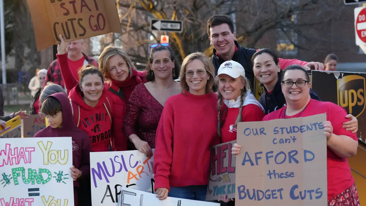 Lexington Education Association members rally for fully funded schools outside of Town Meeting in March after the superinendent of schools proposed major cuts to the school budget.