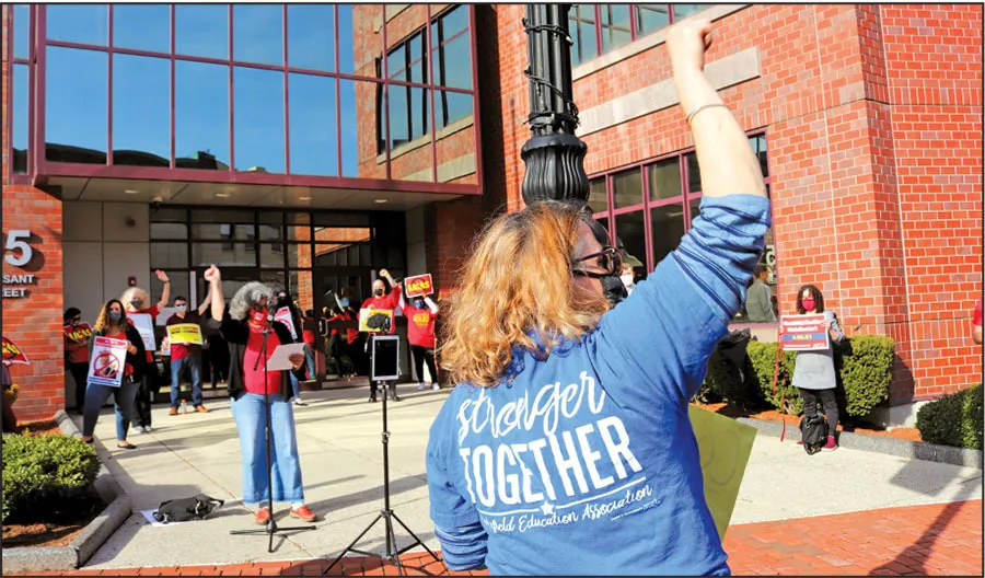 Bridget Reed, a teacher at Wakefield Memorial High School, gestured to the crowd during a March 25 demonstration at the Department of Elementary and Secondary Education’s Malden headquarters to protest the state’s overreach on school reopenings and MCAS testing