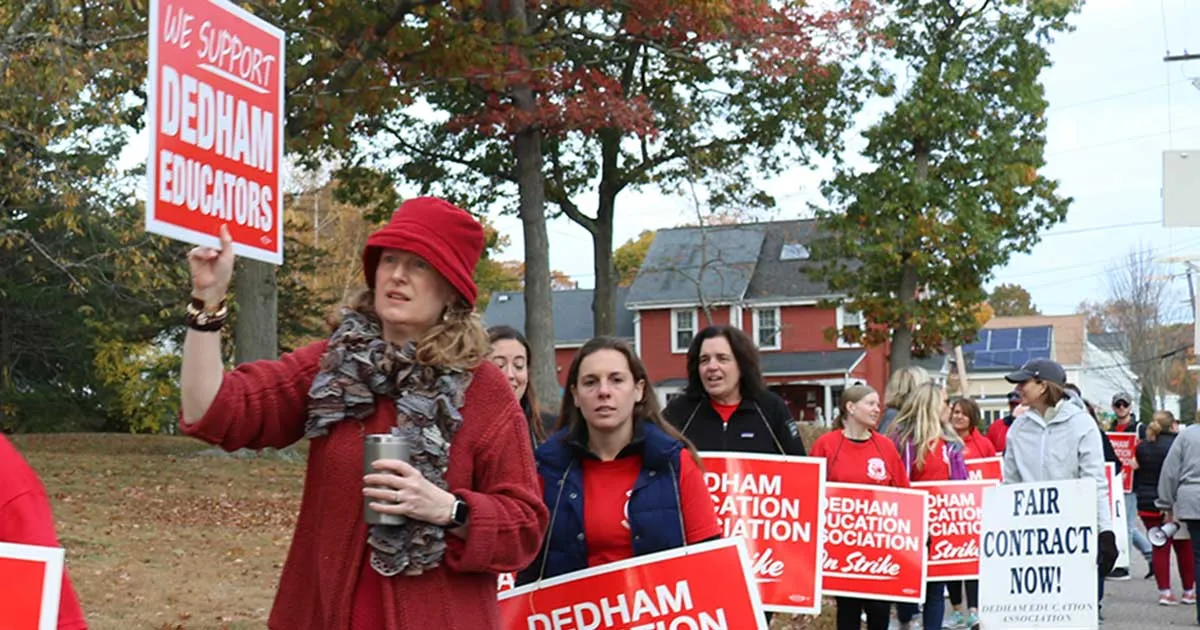 Demonstrators wearing red walked the picket line at the Oakdale Elementary School.