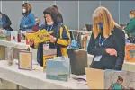 ESPs attending a workshop called "All Kinds of Diversity: Books and Materials for PreK-6 Classrooms" perused samples of works that could be added to classrooms or libraries.