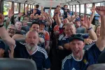 Scots, members of the 'Tartan Army' cheering inside one of the many yellow school buses they took to Foxborough to watch World Cup games.