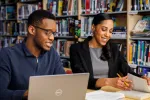 New Bedford graduates Elliott Talley and Kibi Williams-Brown. Williams-Brown is now an English teacher at New Bedford High School