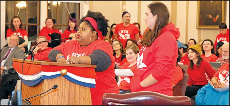 Local actions for Education Support Professionals are picking up. Paraprofessional Daphnee Balan gave impassioned testimony at a Somerville School Committee meeting. Standing with her is Margaret Whittier-Ferguson, head of the local’s contract action team.