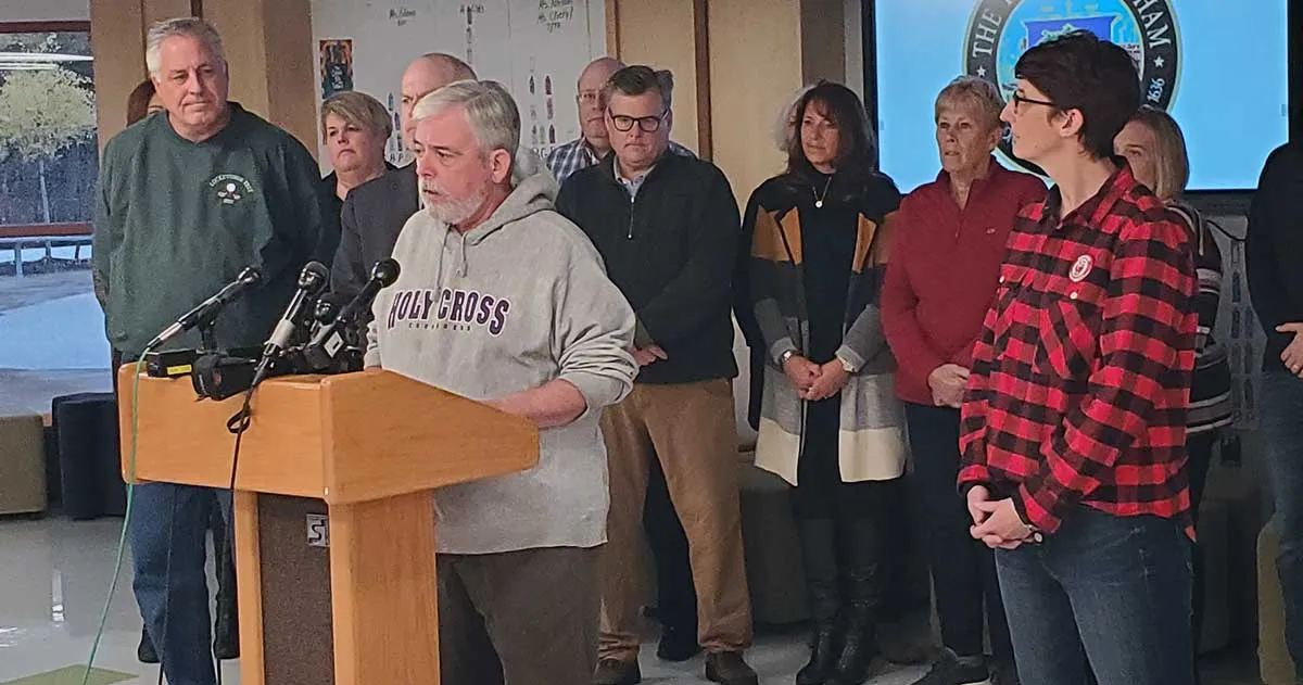 Negotiators listened as DEA President Tim Dwyer spoke to the media about the tentative agreement.