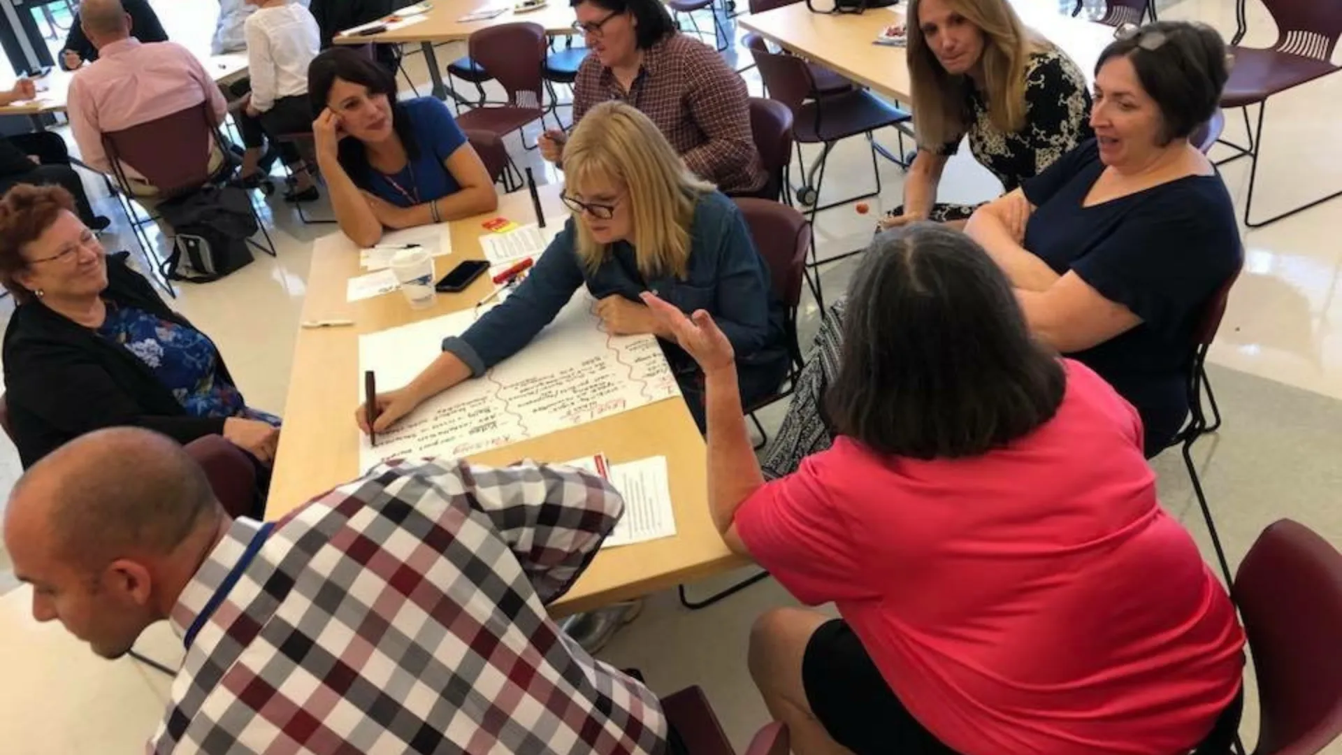 MTA members working around a table.