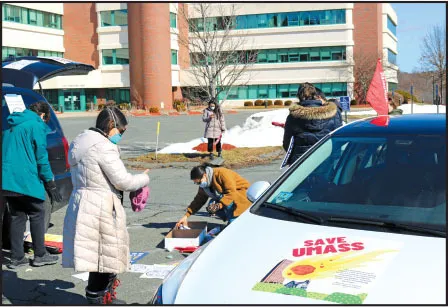  Protesters prepared for a "Bring Staff Back" demonstration at UMass Amherst on Feb. 26. 