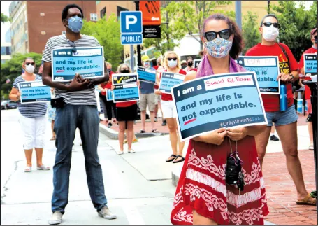 More than 100 educators and other community members turned out for a rally on July 30 in Malden