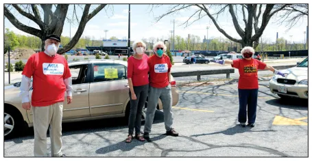 The Wisdom Warriors attended a caravan protesting layoffs at UMass Lowell in May.