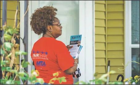 Tracey Pratt, a member of the Cambridge Education Association, canvassed in a Somerville neighborhood in mid-May.