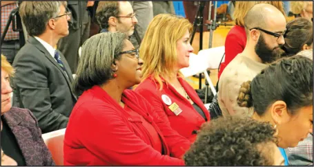 Weston teacher Zena Link, left, and Chicopee teacher Laura Demakis reacted to a speaker at the Student Opportunity Act signing ceremony on Nov. 26. 