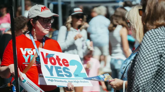 MTA members and staff campaigning for Yes on Question 2, which aimed to remove high-stakes testing, at the Melrose Farmers Market in October 2024.