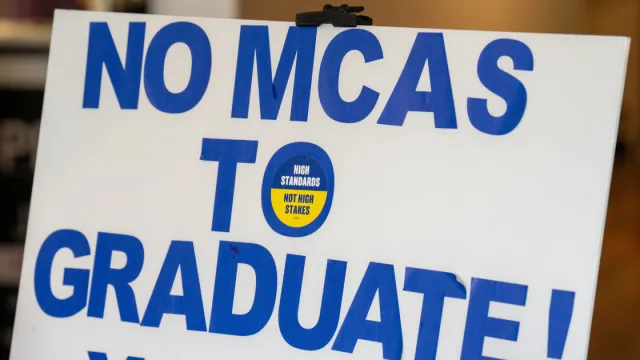 A sign made by parents to promote the 2024 ballot question to end the MCAS as a graduation requirement for Massachusetts students.